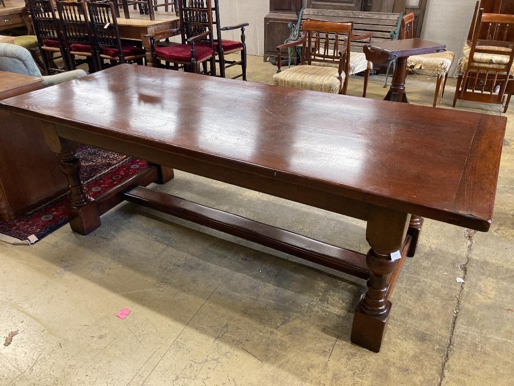 An 18th century style oak refectory dining table, length 228cm, depth 91cm, height 76cm